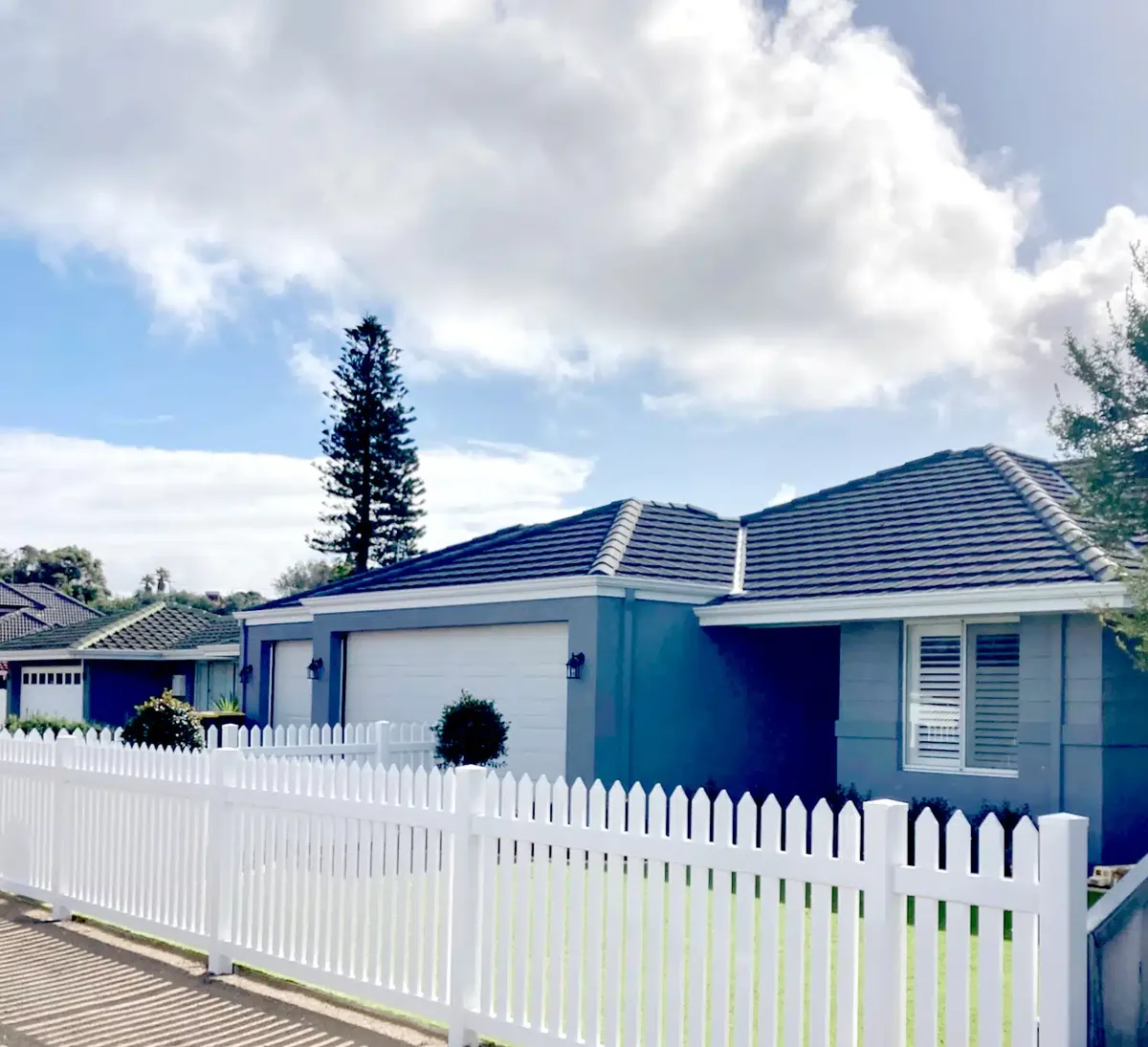 White PVC picket fence in front of a Perth home
